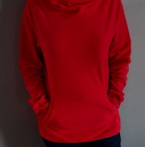 Orange pink sweater finger cutouts